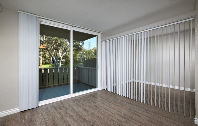Studio living area with bedroom separation and patio