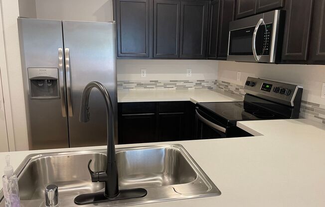 3 Bedroom Townhome w/FULLY FENCED YARD & GARAGE!!