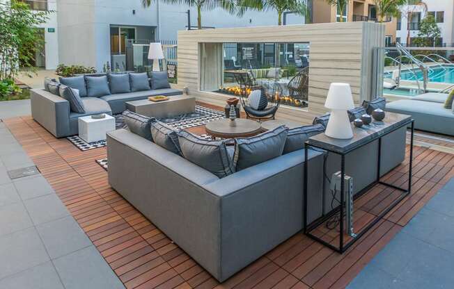 A modern outdoor seating area with a DJ booth.