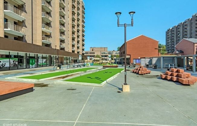 Enjoy games in The Plaza like bocce ball at Trillium Apartments, Virginia, 22031