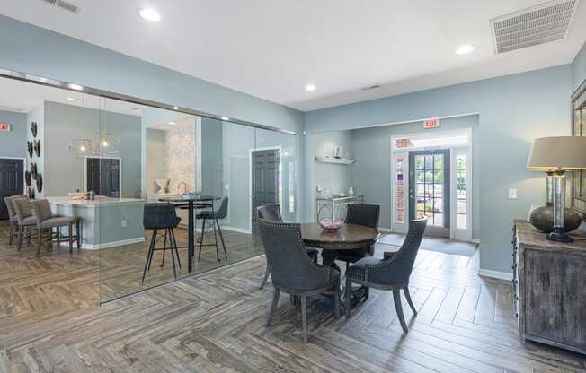 a large room with tables and chairs and a glass wall