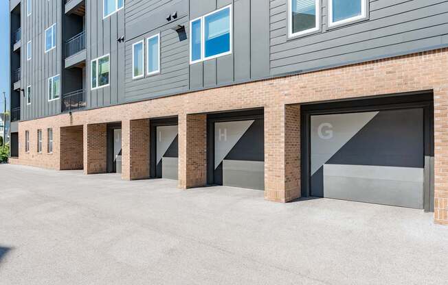 A building with a grey facade and a row of windows.