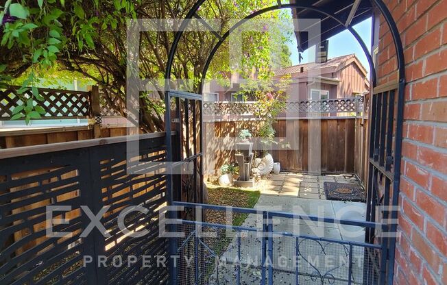 2/1 Single Story Condo With 2 Car Garage, Private Front & Back Patio & Updates Throughout!
