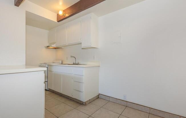 a white refrigerator freezer sitting inside of a kitchen
