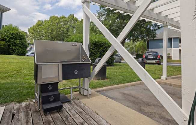 a grill on a porch in front of a house