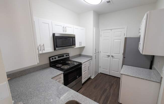 Renovated kitchen featuring appliance at Center Point Apartments, Indianapolis