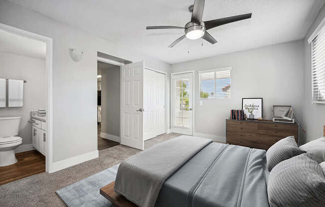 Model Bedroom with Carpet and attached Bathroom at Stillwater Apartments located in Glendale, AZ.