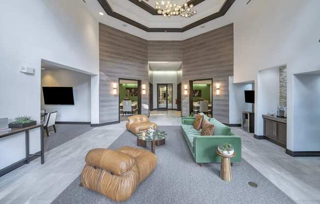 the lobby of a hotel with couches and a reception desk at The Hendrix, Atlanta, GA