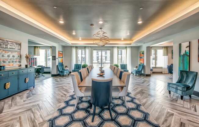 a conference room with a long table and chairs and a chandelier