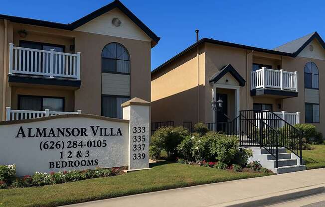 The image shows a building with the name Almansor Villa and a sign in front of it.