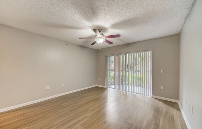 Livingroom with woodstyle floors and ceiling fan at Pembroke Pines Landings, Pembroke Pines, FL, 33025