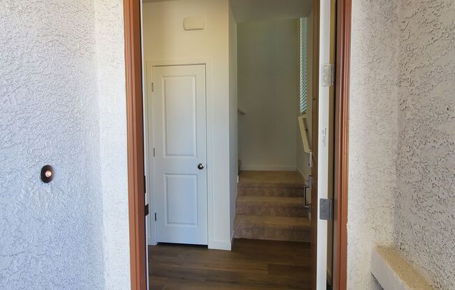 Contemporary townhome with modern exterior and attached garage.