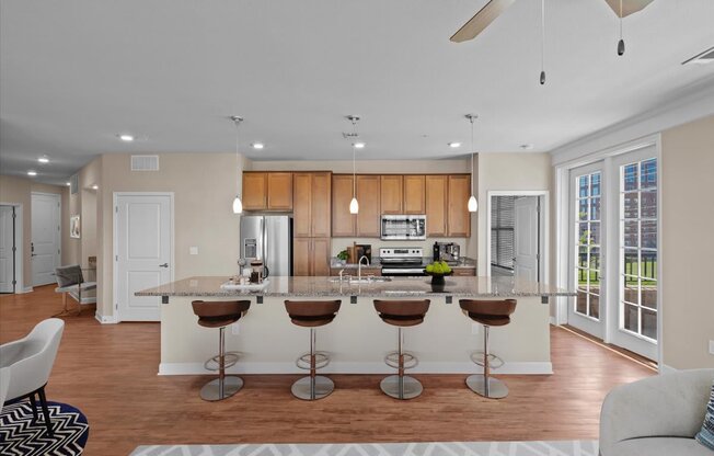 a kitchen and living room with a large island