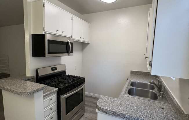 Kitchen with Stainless Steel Appliances and White Cabinets