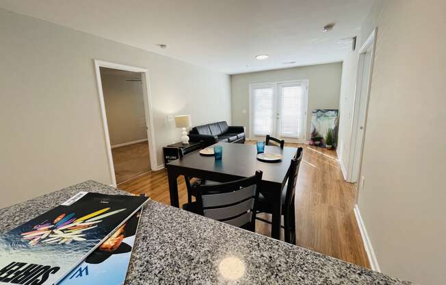 Kitchen bar overlooking dining space at Oasis at Cedar Branch in Wilmington, NC