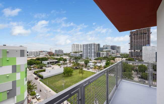 a balcony with a view of the city