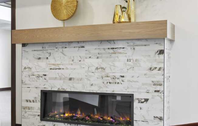 a living room with a fireplace and a round table