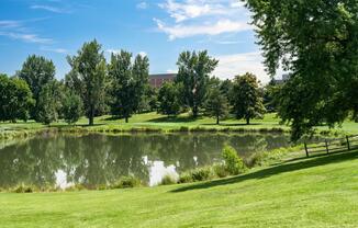 Tranquil pond views and wide-open green space at Harvard Gulch Park—just around the corner from Modera University Park.