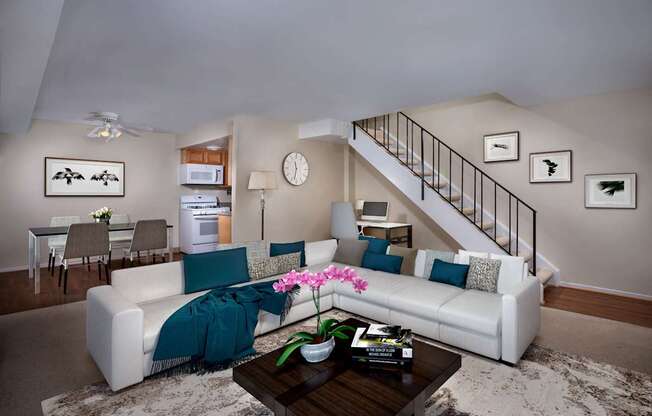 a living room with a white couch and a coffee table