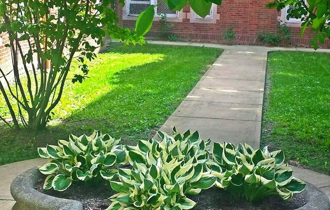 Lovely courtyard with well maintained landscaping