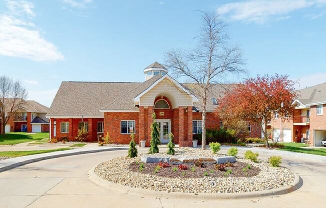 Brick exterior of the leasing office and community clubhouse at The Northbrook Apartments