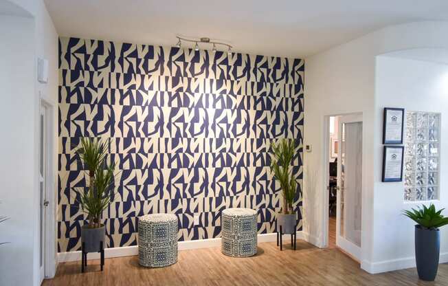 Navy Blue and Ivory Wall with trendy modern stools outside of leasing office