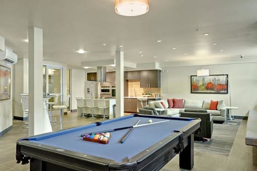 Two-Bedroom Apartments in Kirkland, WA - Kirkland Crossing - Clubhouse with Billiards Table, Community Kitchen, and Seating Area