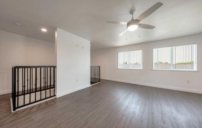 Upstairs Bedroom with Ceiling Fan Stairs View.jpg
