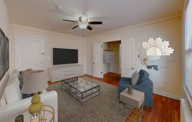 living area with sofa, coffee table, credenza, tv, and hardwood floors at 2801 Pennsylvania apartments in washington dc