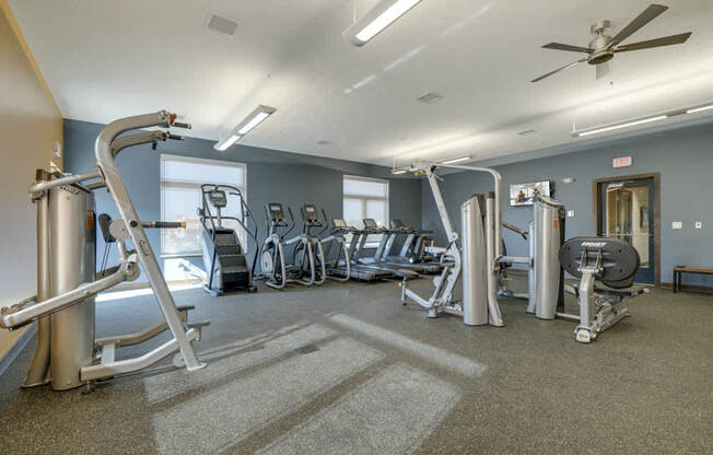 WH Flats apartments' expansive gym with cardio and weightlifting equipment in south Lincoln NE