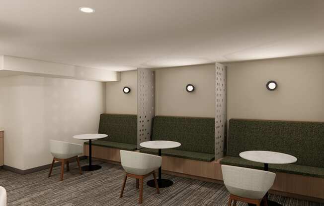 A white room with a green bench and a table.