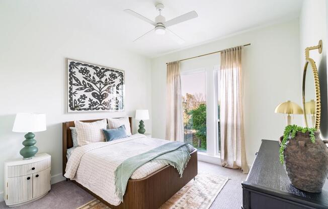 Bright and airy bedrooms at Modera Trailhead feature oversized windows and refined finishes, creating a restful retreat in Dallas.