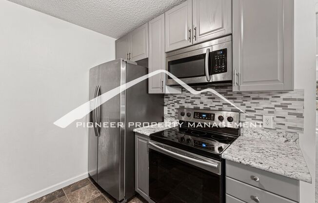 Updated Condo With 2 Covered Parking Spots & Washer/Dryer