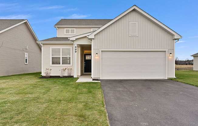 A house with a garage is shown in the image.