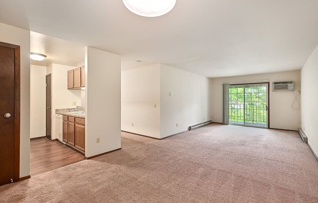 Living Room with connected balcony at river's edge apartments