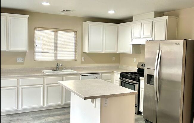 SW!!! OVER 2000 SQ FT!!! New Carpet!!! New Flooring!!! Freshly Painted!!! 4 bed 3 bath!!! Low Maintenance Desert landscape Front and back!!!