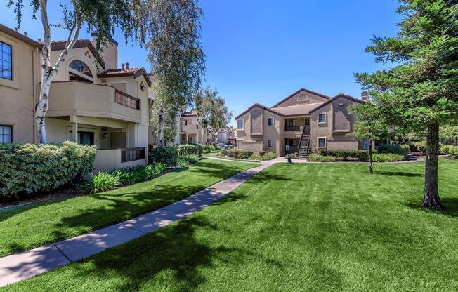 a house with a lawn in front of a building