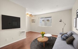A living room with a couch and a coffee table