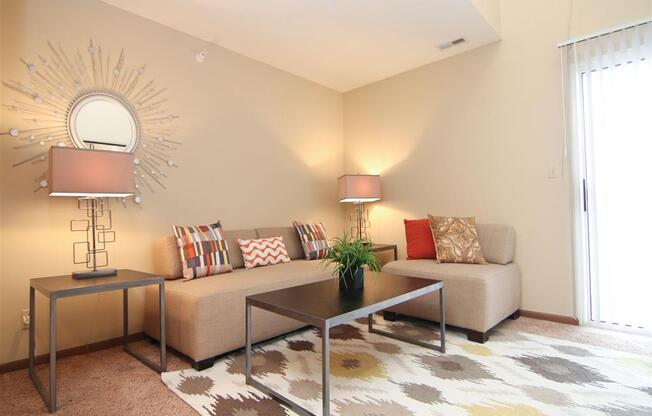 amazing living room with lots of natural lighting at Pine Lake Heights Apartments in Lincoln Nebraska