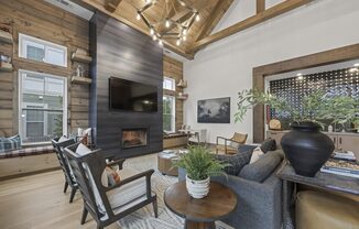 a living room with a fireplace and a tv