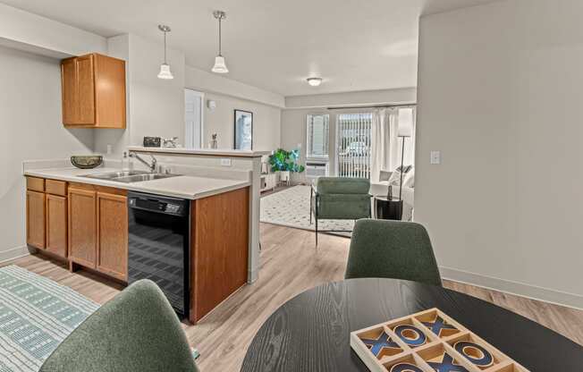 an open kitchen and dining room with a table and chairs