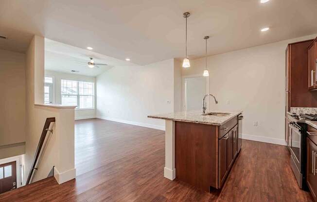 A kitchen with wooden floors and a countertop.