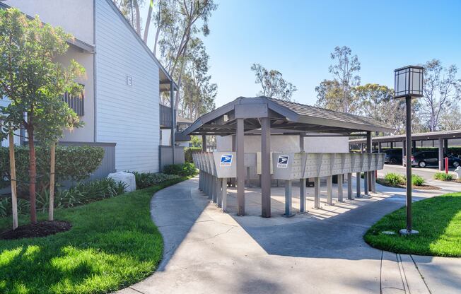 A building with a mailbox in front of it.
