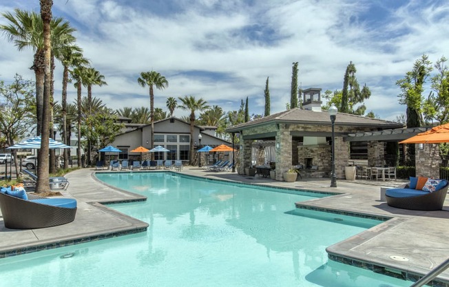 Outdoor pool area with seating