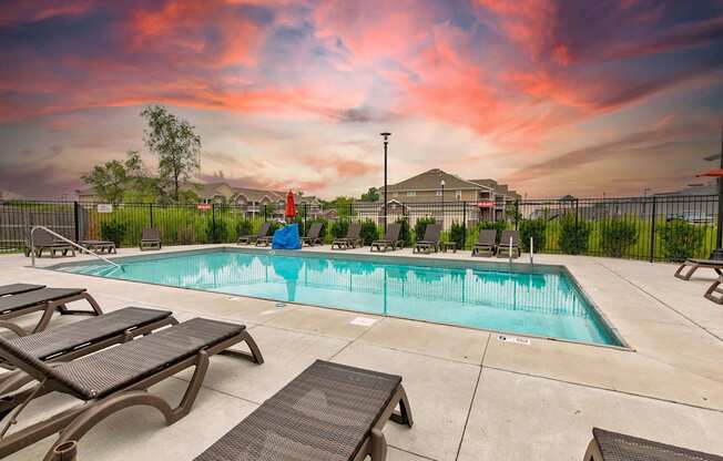 the pool at our apartments with tables and chairs around it at Lake Shore Apartments, Ankeny, 50021