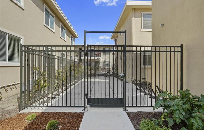 Steel gate and bike racks at Parkside Apartments, Davis, 95616
