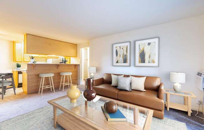 A living room with a brown couch and a coffee table.