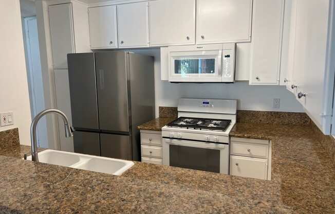 Kitchen with White Appliances and White Cabinets