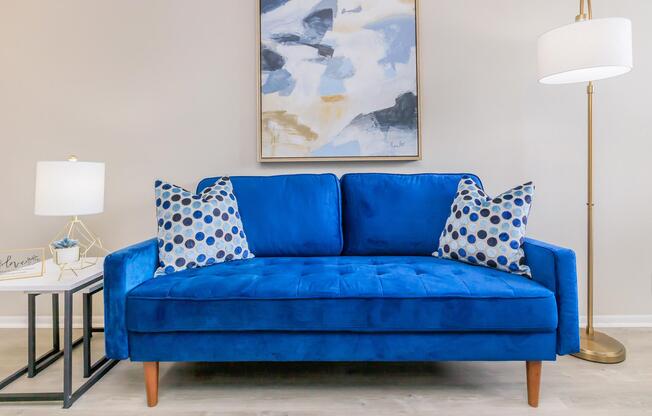 a living room with a blue chair