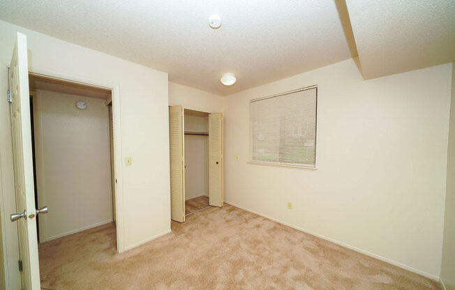 Bedroom with Large Closet at Madeira Apartments in Kalamazoo, MI